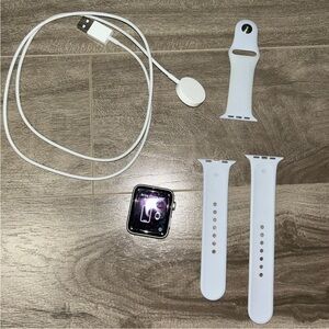 Apple Watch Series 3 with charger and grey band